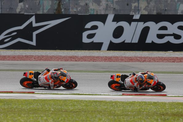 Marc Márquez and Dani Pedrosa, riding their Repsol Honda's at the 2013 Malaysian Grand Prix.
